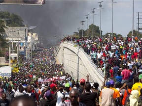 Thousands march in Port-au-Prince, Haiti as they chant anti-government slogans during a protest Feb. 7, 2019 to demand the resignation of President Jovenel Moise.