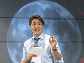 Prime Minister Justin Trudeau speaks to high school students at the Canadian Space Agency headquarters Thursday, Feb. 28, in St-Hubert.