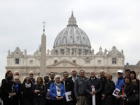 Members of the ECA (Ending of Clergy Abuse) organization and survivors of clergy sex abuse pose for photographers outside St. Peter's Square, at he Vatican, Monday, Feb. 18, 2019. Organizers of Pope Francis' summit on preventing clergy sex abuse will meet this week with a dozen survivor-activists who have come to Rome to protest the Catholic Church's response to date and demand an end to decades of cover-up by church leaders.