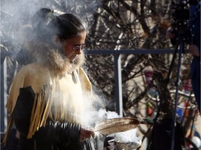 An Indigenous elder performs a smudging ceremony, a purification ritual. St. Paul's Hospital in Vancouver allows smudging in the hospital; offers its patients traditional food; and welcomes Indigenous patients with blankets, a symbol of care in the local culture,  Daniel Campos Caramori and Sophia Zaia write.