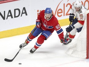 Canadiens' Jonathan Drouin holds off Florida Panthers' Aleksander Barkov in Montreal on Jan. 15, 2019.