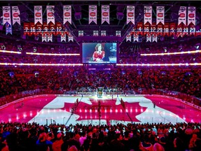 The Canadian flag is projected onto the ice at the Bell Centre during the singing of national anthem before NHL game between the Canadiens and Florida Panthers at the Bell Centre in Montreal on Tuesday, Jan. 15, 2019.