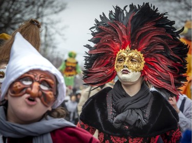 Megan Parent dressed in a traditional Italian theatre costume looks around as she parades through Little Italy in Montreal, on Saturday, March 2, 2019.