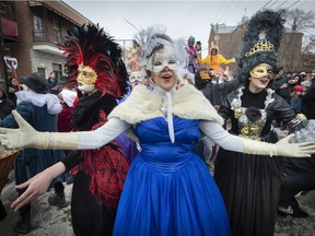 Megan Parent left, Jenny Yejet middle, and Aracelle Lello right sing an old Italian folk son dressed in traditional Italian theatre costume as they lead a parade through Little Italy in Montreal, on Saturday, March 2, 2019.