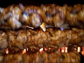 Chickens cook in a charcoal fired oven at Chalet BBQ in Montreal, on Thursday, March 7, 2019.
