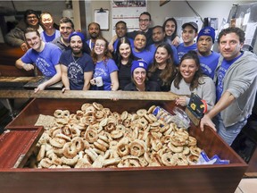 Staff gather for one last picture on the last day of business for St-Viateur Bagel on Monkland Ave. in the N.D.G. district of Montreal on Monday, March 11, 2019.