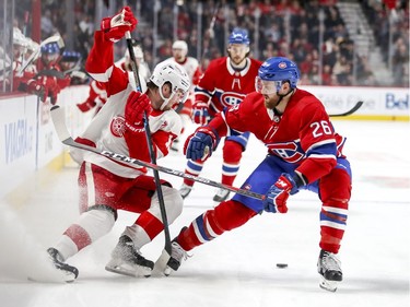 Montreal Canadiens' Jeff Petry, right, knocks the puck away from Detroit Red Wings Filip Zadina during second period of National Hockey League game in Montreal Tuesday, March 12, 2019.