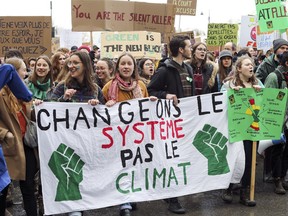 Demonstrators walk south on Parc Ave. in Montreal Friday March 15, 2019 while taking part in the worldwide Youth Climate Strike.