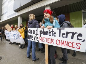 Students from École Robert Gravel in Montreal block the school's entrance to protest against climate change March 15, 2019.