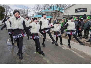 Members of the Costello Irish Dance group make their way along Main Street during the 10th Annual Hudson St. Patrick's Parade in Hudson on Saturday.