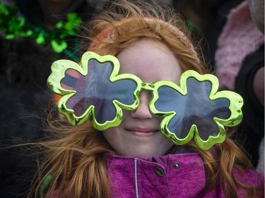 Kayla Hutthingame of Les Coteaux enjoys watching the 10th Annual Hudson St. Patrick's Parade in Hudson.