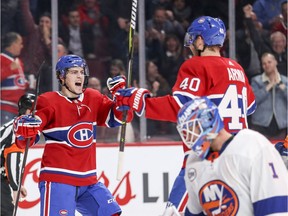 The Canadiens' Jordan Weal, left, celebrates with Joel Armia after Armia's first-period power-play goal against the New York Islanders during NHL game at the Bell Centre in Montreal on Thursday, March 21, 2019.