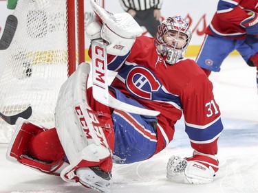 Montreal Canadiens Carey Price scrambles to his feet after making a save during second period of National Hockey League game against the New York Islanders in Montreal Thursday March 21, 2019.