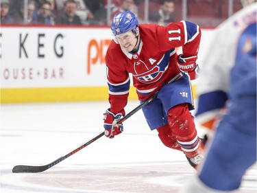 Montreal Canadiens' Brendan Gallagher grimaces after being checked during first period of National Hockey League game against the New York Islanders in Montreal Thursday March 21, 2019.
