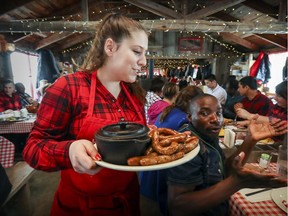 Waitress Gabrielle Latulippe helps diners fill up at Cabane à sucre Handfield in St-Marc-sur-Richelieu.