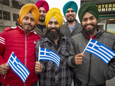 MONTREAL, QUE.: MARCH 24, 2019 --  Members the Sikh community enjoy the  celebrations at the Hellenic Community of Greater Montreal's annual Greek Independence Day Parade in Montreal, on Sunday, March 24, 2019. (Peter McCabe / MONTREAL GAZETTE) ORG XMIT: 62298