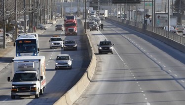 Taxi drivers bring Cote-de-Liesse to a halt during a strike by taxi drivers as they protest new legislation deregulating parts of the taxi industry in Montreal, on Monday, March 25, 2019.