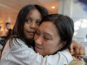 Vanessa Rodel and her 7-year-old daughter, Keana, at Trudeau airport on Tuesday.