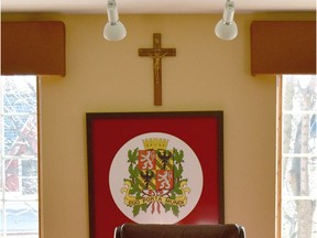 A crucifix hangs on the wall behind the mayor's chair in the Dorval council chamber.