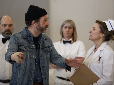 McMurphy, played by David Anderson speaks with Nurse Ratched  played by Lisa Vindasius  in a rehearsal by The Hudson Players Club adaptation of One Flew Over the Cuckoo's Nest. The play will run from April 4-14. Behind are aides Dan Wheeler and Karen Delorme.