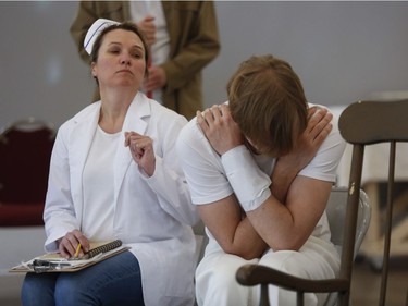 Nurse Ratched  played by Lisa Vindasius looks towards Billy Bibbit, played by Kyle  Shillibeer in a rehearsal by The Hudson Players Club adaptation of One Flew Over the Cuckoo's Nest.