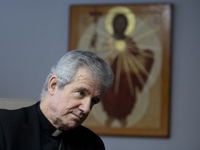 Archbishop Christian Lepine speaks with the media in the boardroom of the Roman Catholic Archdiocese of Montreal  on Wednesday, March 27, 2019.