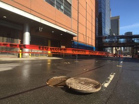 The site of a water-main break across from the entrance to the Bell Centre's underground parking on Wednesday, March 27, 2019.