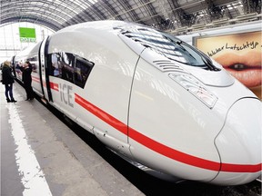 FRANKFURT AM MAIN, GERMANY - FEBRUARY 18:  The latest generation of the ICE 3 Deutsche Bahn high-speed train, version 407, stands during a media presentation at the main station on February 18, 2014 at Frankfurt/Main, Germany. The operation of version 407 was delayed by two years due to complications with certification. The train, built by Siemens, has a top speed of 320km per hour for the admission in France. In Germany the top speed is around 300km per hour.