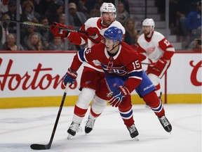 Jesperi Kotkaniemi gets around Detroit Red Wings left wing Thomas Vanek during NHL action in Montreal on Monday, October 15, 2018.