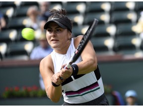 Bianca Andreescu of Canada hits a backhand against Irina-Camelia Begu of Romania during their ladies singles first round match on day three of the BNP Paribas Open on March 6, 2019, in Indian Wells, Calif.