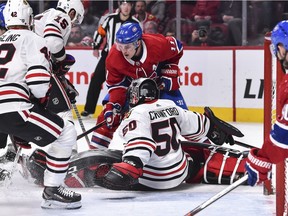 Chicago Blackhawks goalie Corey Crawford makes save on the Canadiens' Brendan Gallagher at the Bell Centre in Montreal on Saturday, March 16, 2019.