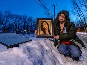 Monique Dalcourt, seen with a photo of her late daughter, Jenique, should have been recognized as a victim long ago, says her lawyer, former provincial justice minister Marc Bellemare, who is contesting the decision in Superior Court.