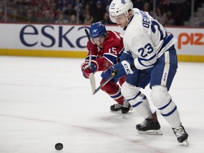 Montreal Canadiens centre Jesperi Kotkaniemi battles for the puck with Toronto Maple Leafs defenceman Travis Dermott in Montreal on Feb. 9, 2019.