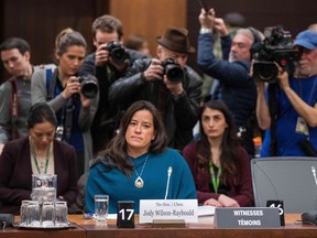 (FILES) In this file photo taken on February 27, 2019 Former Canadian Justice Minister Jody Wilson-Raybould arrives to give her testimony about the SNC-LAVALIN affair before a justice committee hearing on Parliament Hill in Ottawa on February 27, 2019. - Canada's former attorney general has provoked the worst political crisis for Prime Minister Justin Trudeau's Liberal government by accusing senior officials of attempting to head off the fraud prosecution of engineering giant SNC-Lavalin. Jody Wilson-Raybould testified at the House of Commons Justice Committee that Trudeau, one of his ministers and close advisors applied "inappropriate" pressure on her, including "veiled threats" to intervene in a criminal prosecution.