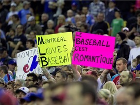 Montreal baseball fans fill the stands during preseason Major League Baseball between the Toronto Blue Jays and the New York Mets at the Olympic Stadium in Montreal on March 28, 2014.