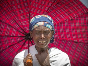 A family member reacts at the scene where the Ethiopian Airlines Boeing 737 Max 8 plane crashed shortly after takeoff on Sunday killing all 157 on board, near Bishoftu, south of Addis Ababa, in Ethiopia March 13, 2019.