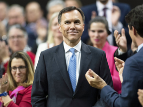 Prime Minister Justin Trudeau and Liberal MPs applaud as Finance Minister Bill Morneau rises to deliver the federal budget on March 19, 2019.