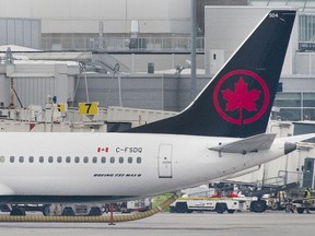 An Air Canada Boeing 737 Max 8 aircraft is shown next to a gate at Trudeau airport in Montreal on Wednesday, March 13, 2019.