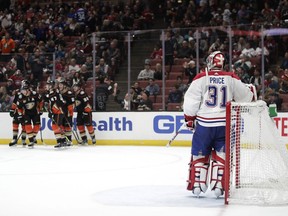 Canadiens goaltender Carey Price stands in front of his net as the Ducks celebrate a goal by Corey Perry on Friday, March 8, 2019, in Anaheim, Calif.