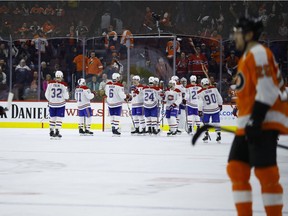 Canadiens players celebrate after beating the Flyers 3-1 during NHL game in Philadelphia on Tuesday, March 19, 2019.