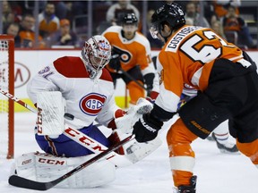 Canadiens goalie Carey Price blocks a shot by Flyers' Shayne Gostisbehere during second period Tuesday night in Philadelphia. Price ended the game with 32 saves.