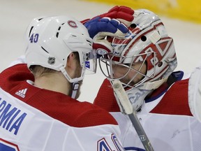 Canadiens' Joel Armia, who scored a hat trick, celebrates Montreal's win with goalie Carey Price, who made 28 saves Friday night in New York.
