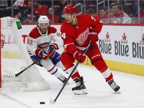 Canadiens' Jonathan Drouin chases Wings defenceman Madison Bowey during a game last week in Detroit. Drouin has been moved off of Max Domi's line and is set to play alongside rookie Jesperi Kotkaniemi against the Kings Tuesday night.