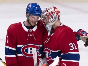 Canadiens' Brett Kulak congratulates goaltender Carey Price after shutting out the New York Islanders 4-0 during NHL hockey action in Montreal on March 21, 2019.