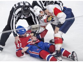 The Florida Panthers' MacKenzie Weegar knocks down the Canadiens' Paul Byron during first-period fight in NHL game at the Bell Centre in Montreal on March 26, 2019.