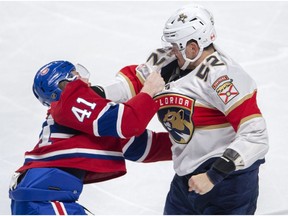 Canadiens' Paul Byron (41) fights with Florida Panthers defenceman MacKenzie Weegar (52) on March 26, 2019, in Montreal.