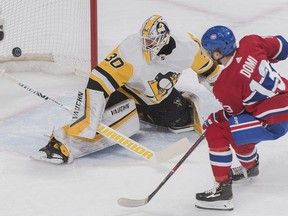 Pittsburgh Penguins goaltender Matt Murray makes a save against Montreal Canadiens' Max Domi during first period NHL hockey action in Montreal, Saturday, March 2, 2019.