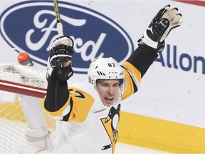 The Pittsburgh Penguins' Sidney Crosby celebrates after scoring on Canadiens goalie Carey Price during first period of NHL game at the Bell Centre in Montreal on Saturday, March 2, 2019.