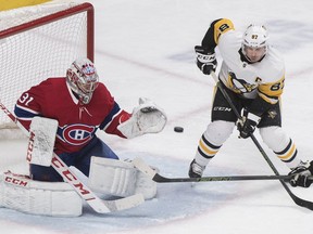 Penguins' Sidney Crosby moves encroaches on Canadiens' Carey Price during second period Saturday night at the Bell Centre.
