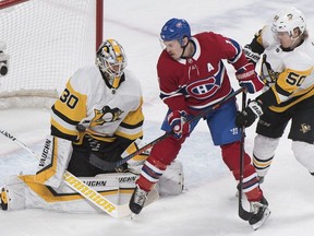 Canadiens' Brendan Gallagher crowds Penguins goaltender Matt Murray as defenceman Juuso Riikola defends during first period Saturday night at the Bell Centre.